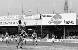Brian Stein about to head the ball across goal