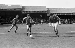 David Moss in a chase for the ball