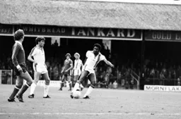 Ricky Hill controls the ball in midfield