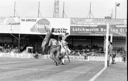 Mike Saxby appears beaten to the ball by the keeper