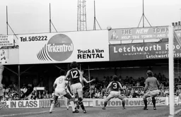 David Moss chips the goalkeeper for the fifth goal