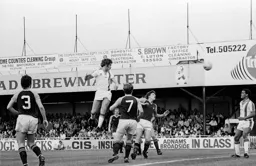 Mike Saxby thunders a header towards goal