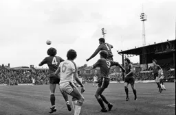 Mike Saxby watches on as the Oldham keeper flies through the air