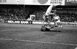 Alan West leaps over Rangers keeper Chris Woods