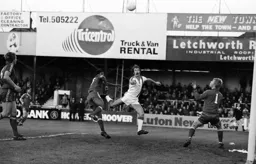 Bob Hatton heads across goal