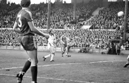 Tony Grealish tries to chip the keeper