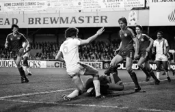 Mike Saxby in a challenge on the keeper
