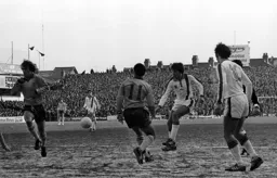 Alan West passes through the Chelsea defence