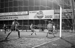 David Moss crosses into the box