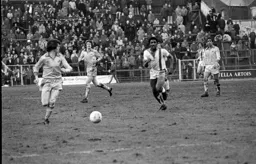 Ricky Hill chases down the ball in midfield