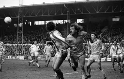 Mike Saxby glances a corner back into the box