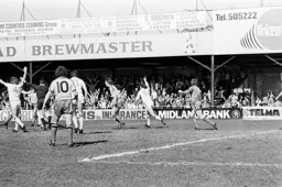 Bob Hatton raises his arm to celebrate his goal