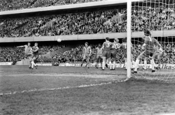 David Moss shoots over the Chelsea wall