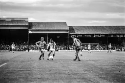 Brian Stein works his way round two defenders