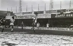 Mal Donaghy furthest Town player upfield