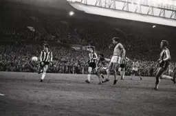 David Moss watches Ricky Hill strike for goal