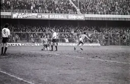 Happy Hatters in the background behind the spike topped fence
