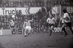 Alan West chips the ball forward