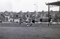 Ricky Hill beats his defender