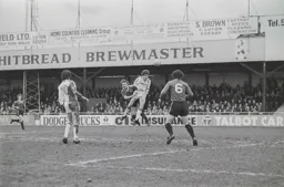 Steve White heads for goal