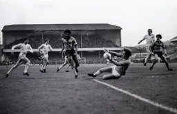 Ricky Hill chips the goalkeeper for the equaliser