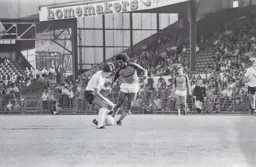 Ricky Hill takes on a Bolton midfielder