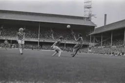 Ricky Hill heads the ball back