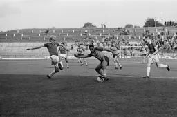 Brian Stein tries to get round ex-Hatter Paul Futcher