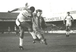 Brian Stein gets his shot away before a tackle comes in