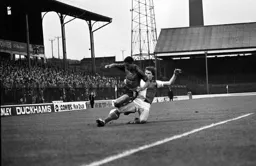 Brian Stein tackled by Rovers Derrick Frazackerly