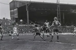 Ricky Hill gets a firm header towards goal