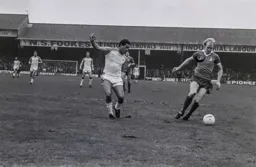 Brian Stein chases ex teammate Paul Futcher