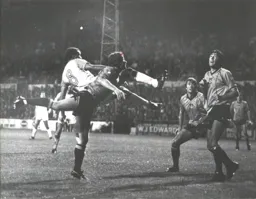 Brian Stein tangles with the Wrexham rearguard