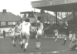 Wayne Turner is just about to be mobbed after scoring for the Town