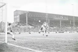 Ricky Hill gets his head to the ball