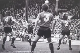 Clive Goodyear gets his head to the ball first