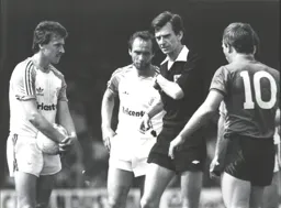 The referee looks to be about to book someone