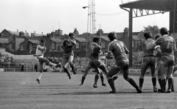 David Moss sees his free kick deflect off the wall