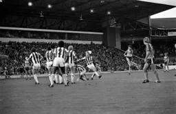 David Moss drives into the Albion wall