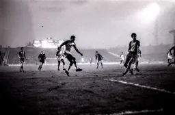 Brian Stein fires in a shot past ex Town defender Chris Nicholl