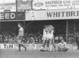 Total dejection on the look of the Watford players as Clive Goodyear is mobbed by colleagues after scoring his goal