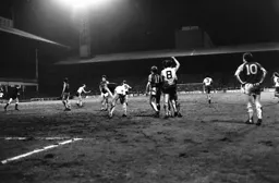 Paul Walsh runs back to the half way line after scoring