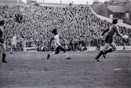 Ricky Hill passing through midfield