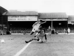 Mark Lawrenson slides in to stop Brian Stein