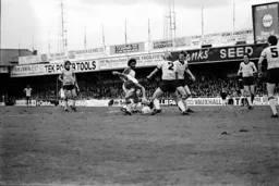 Ricky Hill watches on as Paul Walsh is taken out