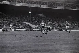David Moss chips forward and is chased down by Forest defender Anderson
