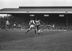 Ricky Hill misses the ball in midfield