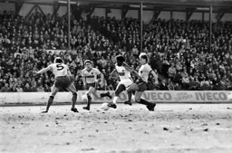 Ricky Hill moving past three defenders