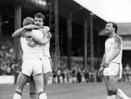 David Moss and Wayne Turner congratulate Paul Walsh on completing his hat-trick