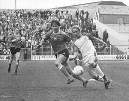 Paul Walsh gets away from a Swansea defender